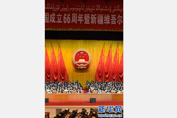 10月1日，慶祝中華人民共和國(guó)成立66周年暨新疆維吾爾自治區(qū)成立60周年大會(huì)在新疆人民會(huì)堂隆重舉行。 新華社記者 高潔 攝 
